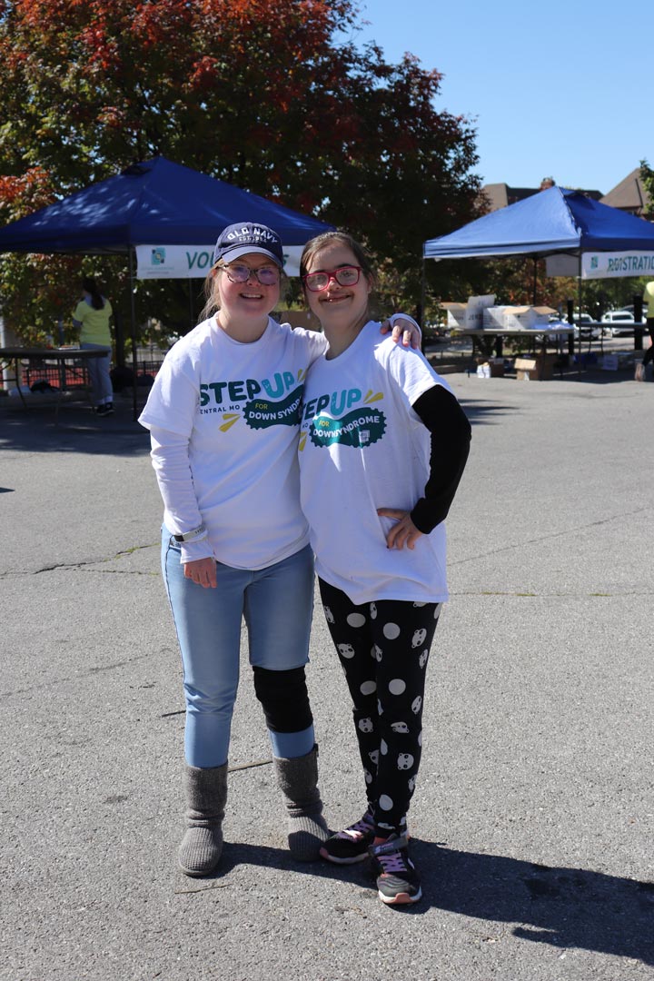 Blue Hat Girl Hugging Red Glasses Girl