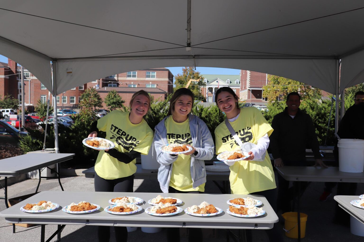 Volunteers Smiling Passing Out Food